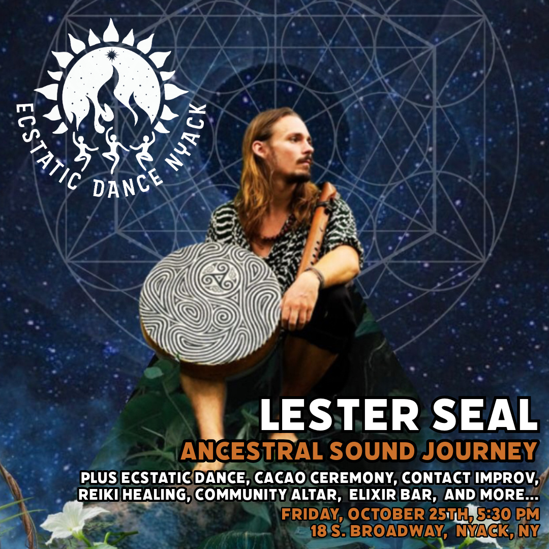 Lester Seal holding a shaman frame drum sitting on a rock.